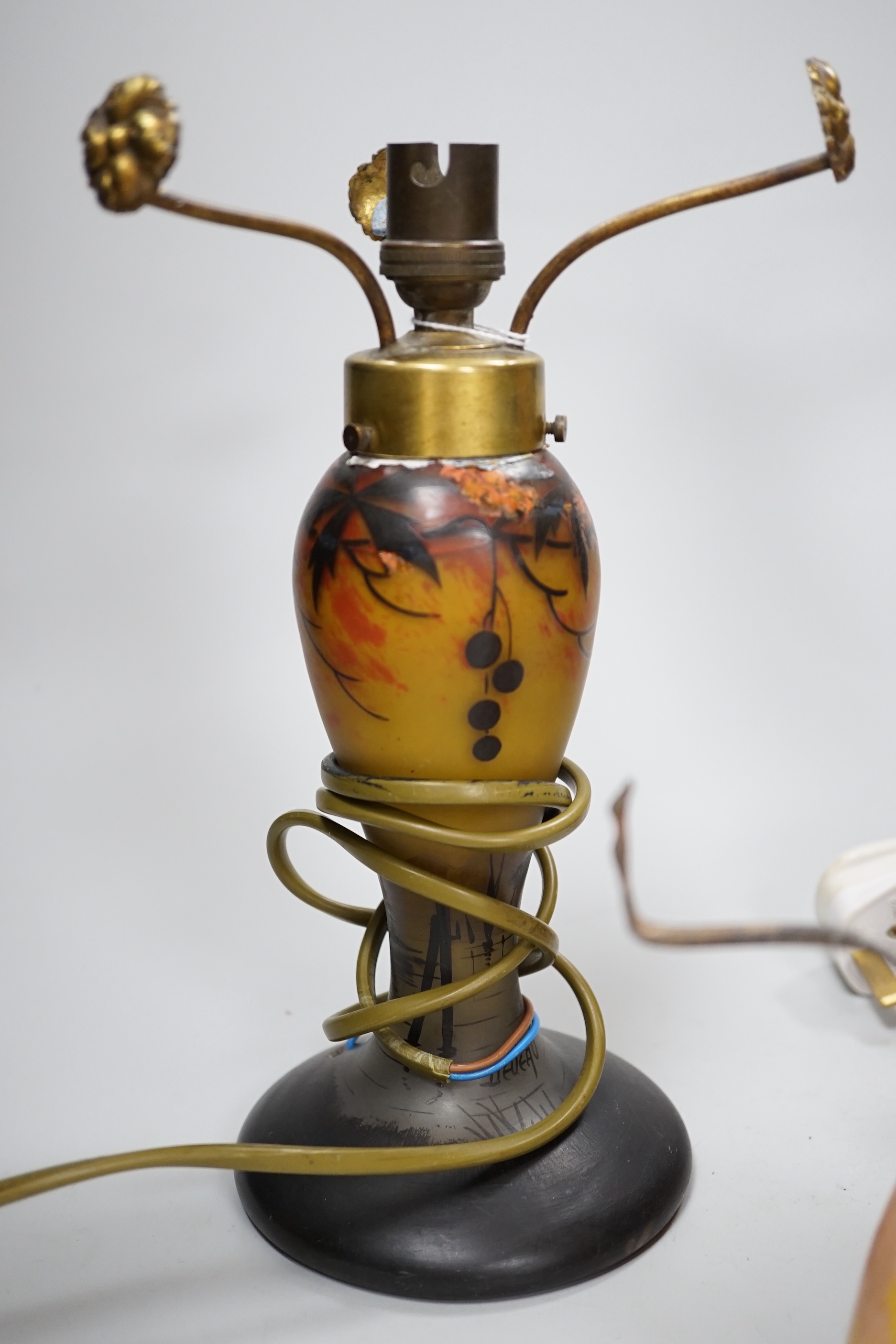Three decorative glass lamp bases including a Galle style example, the largest 34cm including the fitting